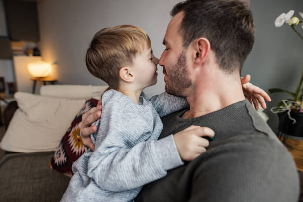 istock Young boy hugging  his father. Weekend activities. 1401749992
