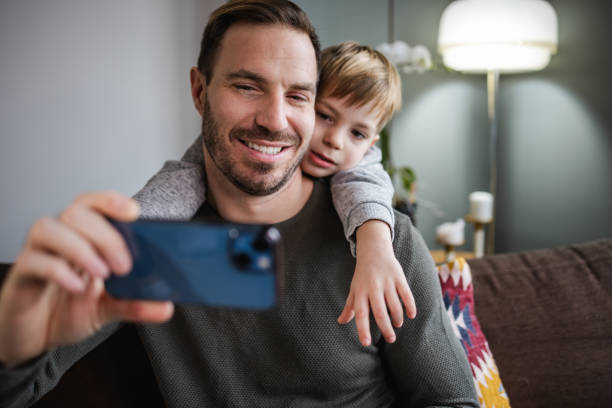 istock Father and son taking a selfie 1401750494
