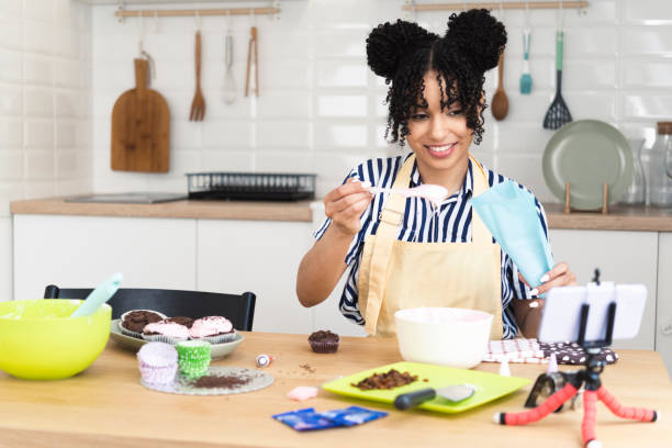 istock Portrait of a young woman filming a tutorial about making cookies 1401751661