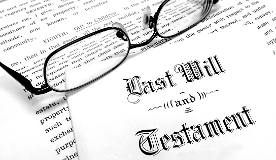 Envelope with Last Will and Testament glasses and estate planning