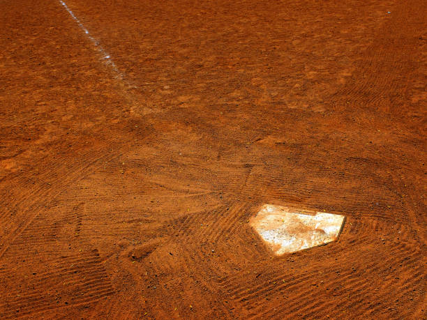 Baseball home plate in fresh dirt on a ball diamond for competition in a game scoring