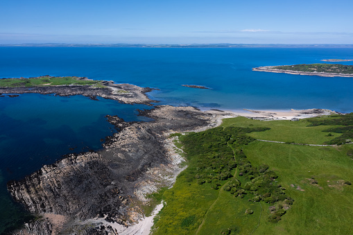 Aerial view of a coastal scene in rural Scotland on a bright sunny summer morning