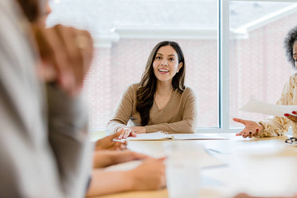 istock Team lead encourages team member 1401762904