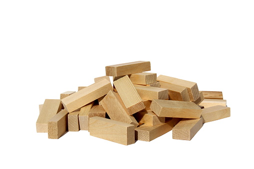 A pile of jenga game details lies on a white background.