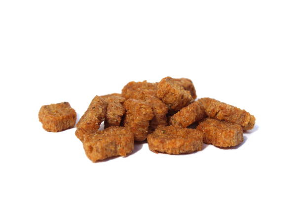 istock A pile of brown crackers on a white isolated background. 1401763619