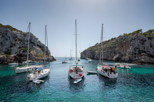 Sailing boats anchored in Cales Coves stock photo