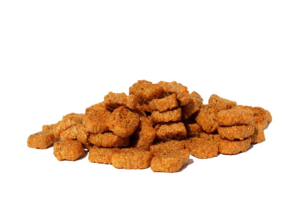 istock A pile of brown crackers on a white isolated background. 1401764276