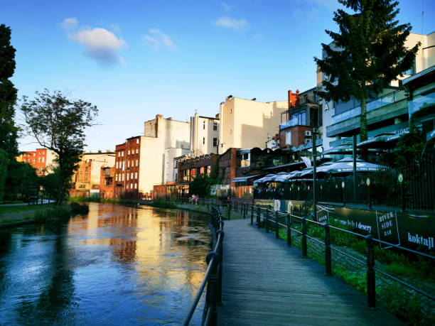The old town houses with footbridge over Mlynowka river Brda and Mill Island,  Bydgoszcz, Poland
