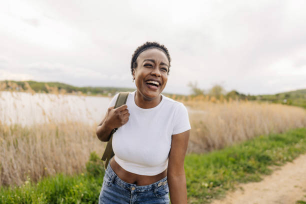 istock Young smiling woman in the nature 1401766631