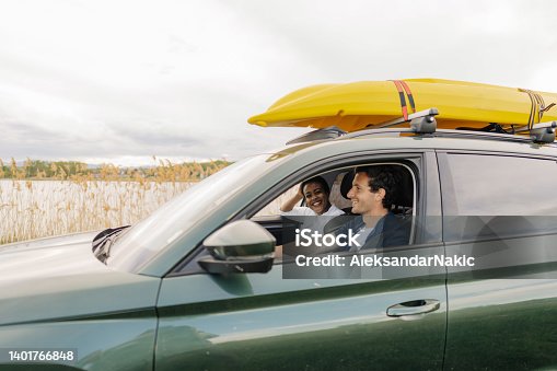 istock Smiling couple on the way to the lake 1401766848
