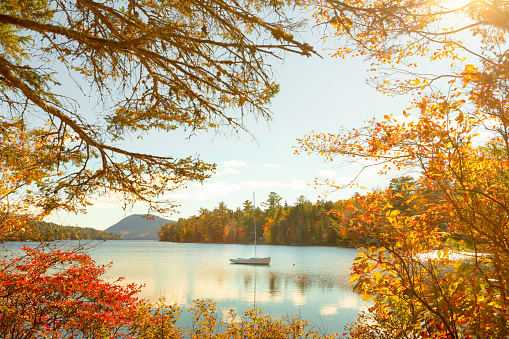 Tranquil, romantic scenery with a sailboat on the Long Pond in the Acadia National Park, Maine