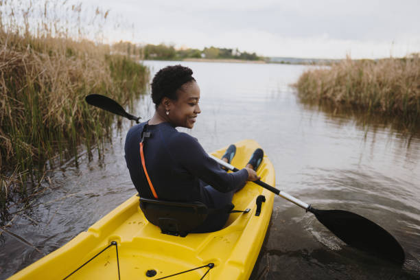 istock Young woman kayaking on the lake 1401768152