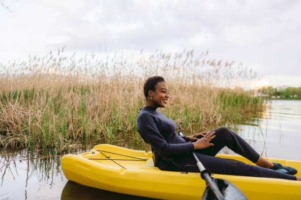 istock Young woman kayaking on the lake 1401768484