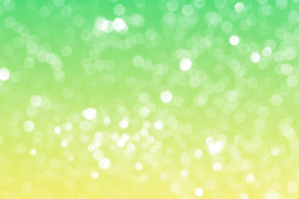 Summer green sparkling glitter bokeh background, abstract defocused lights texture