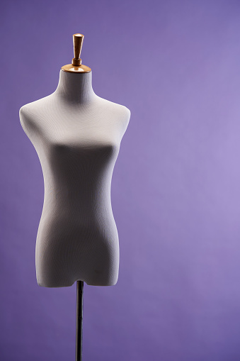 Traditional mannequin  against purple background
