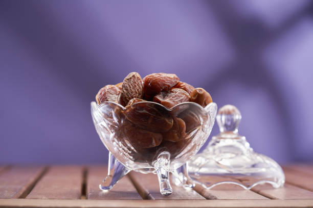 dry fruit date on purple background