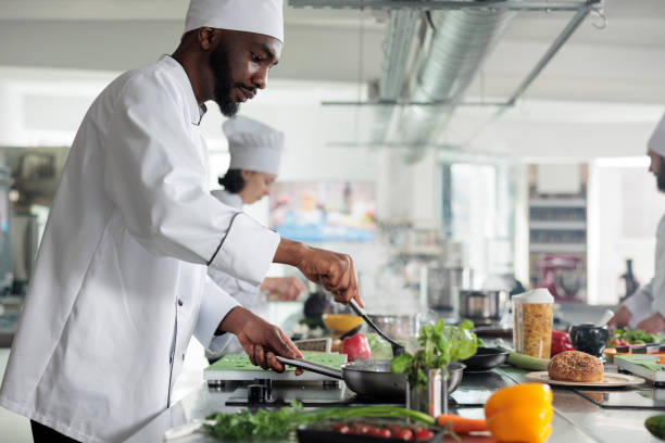 istock Food industry worker preparing meal in restaurant professional kitchen 1401772096