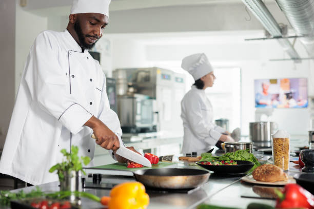 istock Culinary expert in restaurant professional kitchen cooking gourmet dish served at dinner service at evening 1401772105