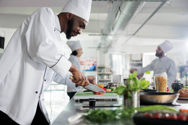 istock Head chef in restaurant professional kitchen preparing delicious meal 1401772111