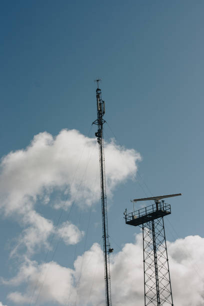 istock Up view. Tower with TV, radio, internet antennas. Providing modern communications. 1401772137