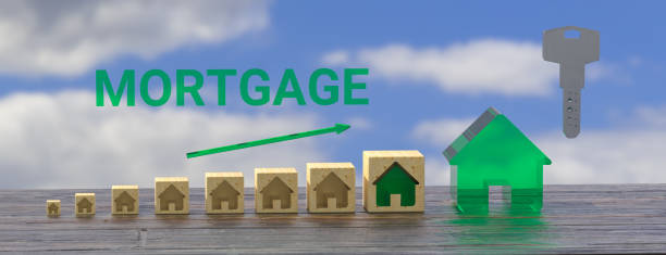 istock Mortgage concept. Wooden house model with copyspace and key. 3d rendering 1401774523