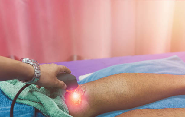 istock physiotherapist using ultrasound head for treatment on knee pain 1401778432