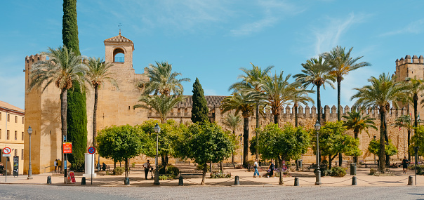 Cordoba, Spain - May 29, 2022: A view of the walls of the Alcazar de los Reyes Cristianos in Cordoba, Spain, a medieval castle, the second more visited landmark in the city