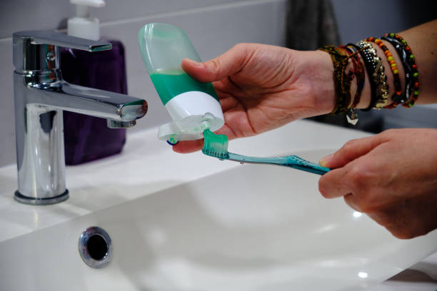 istock Toothbrush with green toothpaste tube 1401778964