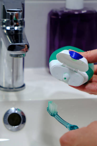 istock Toothbrush with green toothpaste tube 1401778967