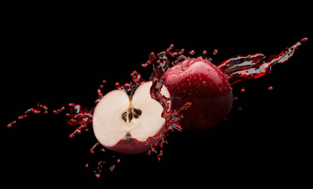 istock red apples in juice splash on a black background with clipping path 1401779138