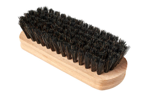 Clothes brush with wooden handle, cleaning household tool, isolated on white background