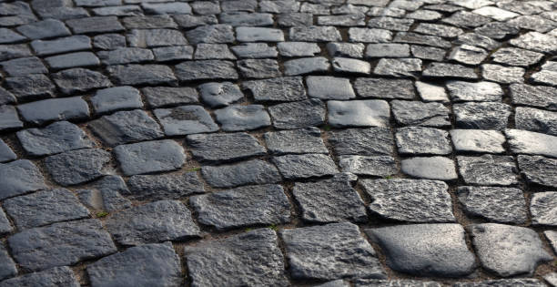istock Shiny black stone pavement. Photo background 1401788398
