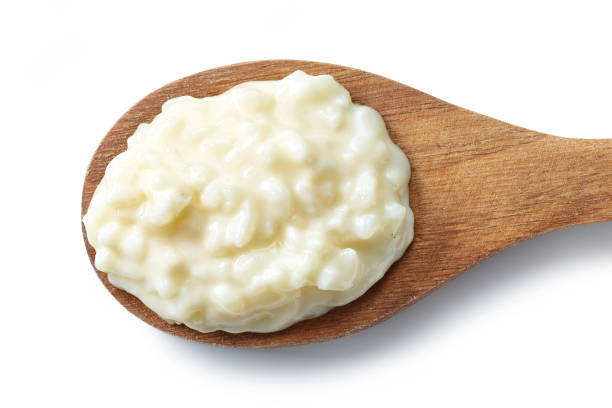 istock wooden spoon of rice pudding 1401790249