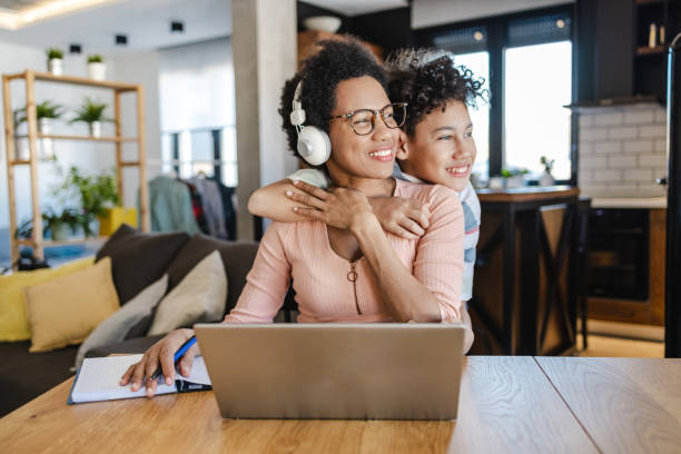 istock Mother is working from home and her son embracing her 1401792630