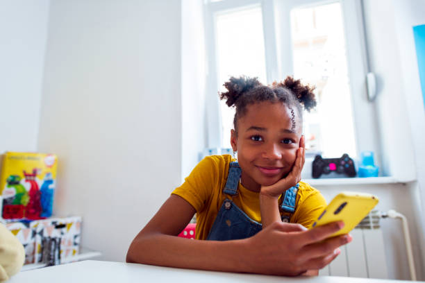 istock School girl using her phone on a break after class 1401793369