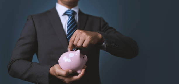 istock Savings planning,Setting a savings goal  saving money each year for future. 1401796342