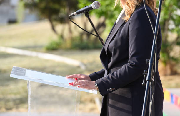istock Female politician giving a public speech 1401796352