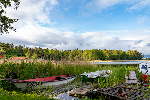 Rowing boats floating over the Lake Selment Wielki waters. Masuria, Mazury Lake District, Poland