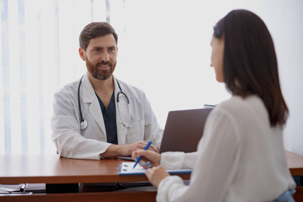 istock Female patient writes down the doctor's recommendations during appointment in clinic 1401798032