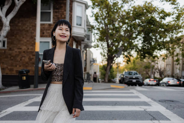istock Well dressed woman walking with a smile 1401799175