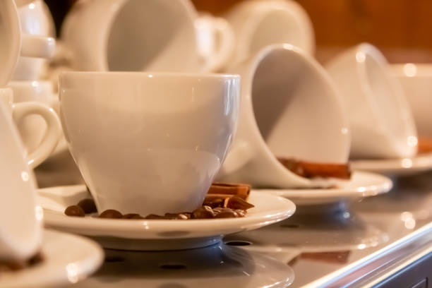 istock Coffee drink on wooden table with blur cafeteria as background 1401799269
