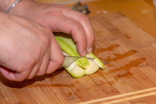 istock Zucchini cut on board, fresh raw vegetable food, green 1401799292