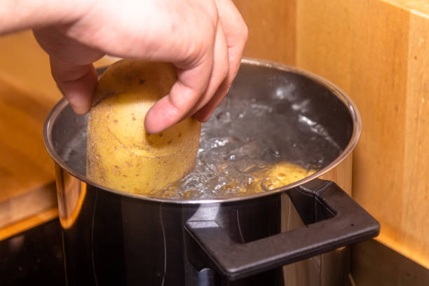 istock Cooking potatoes in a saucepan in boiling water close-up 1401800313