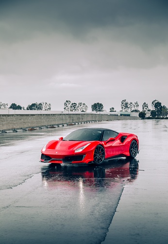 Seattle, WA, USA\n5/22/2022\nFerrari 488 Pista in red parked on a wet road