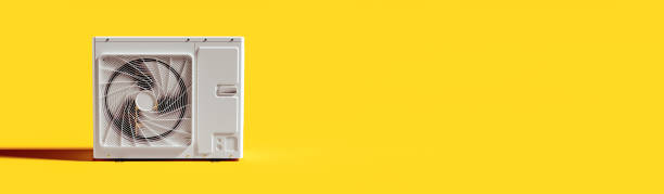istock Air conditioner outdoor unit with copy space on yellow background 1401801471