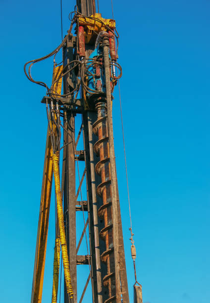istock Hydraulic drilling rig. Installation of bored piles with a casing string. Foundations and grounds. Drilling in the ground. technology. Machine for drilling holes in the ground. 1401802361