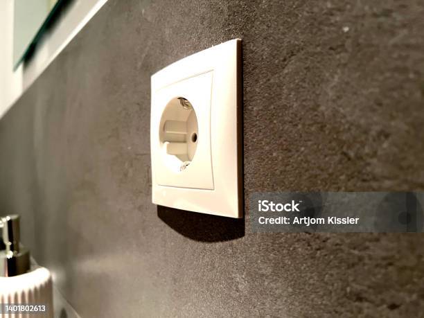 A Socket For Electricity In A Beautiful Dark Tile Stock Photo - Download Image Now - Abandoned, Apartment, Backgrounds