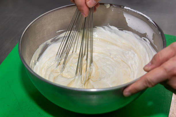 istock whisking egg yolks and sugar in a bowl 1401802665