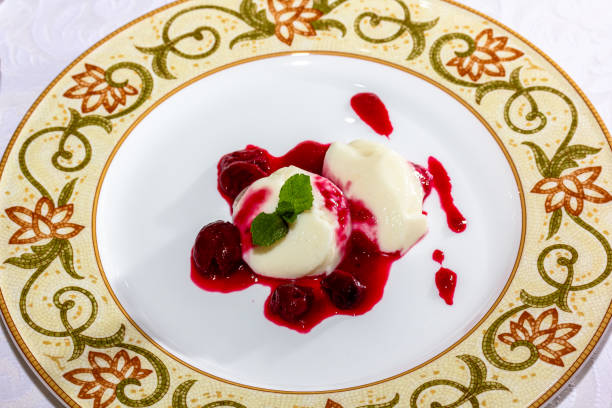 istock Panakota with cherry jelly and mint leaves on a white background 1401802817