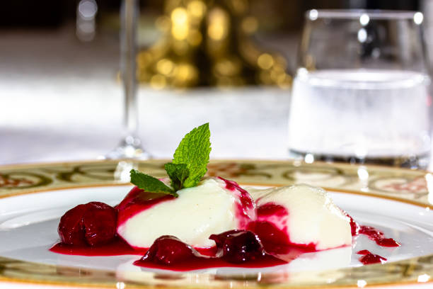 istock Panakota with cherry jelly and mint leaves on a white background 1401802850